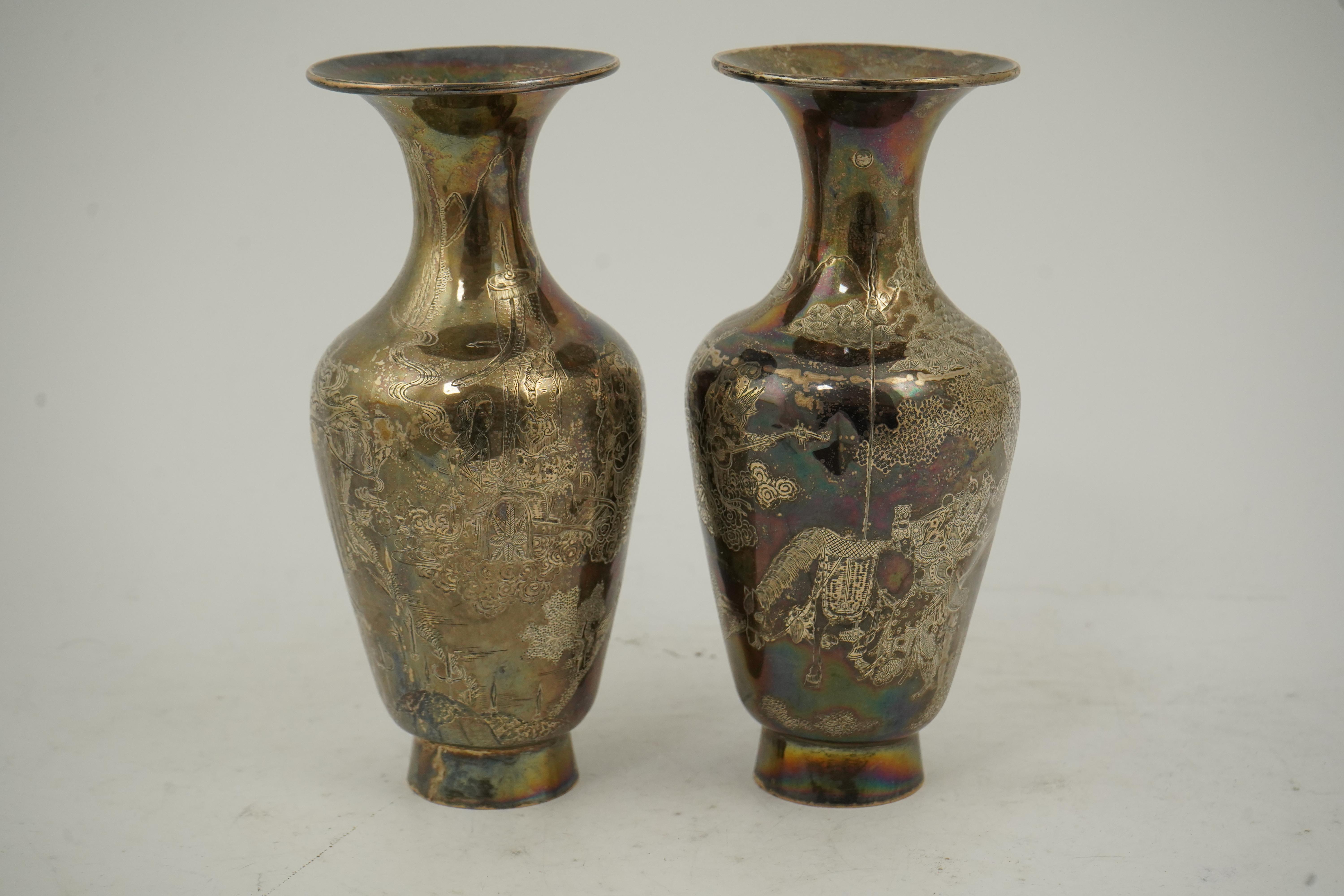 A pair of Chinese silver ‘immortals’ vases, late 19th century